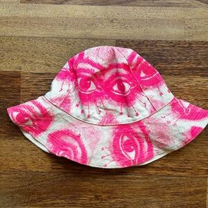 Bucket hat features a vibrant pink and white eyes design - NEW